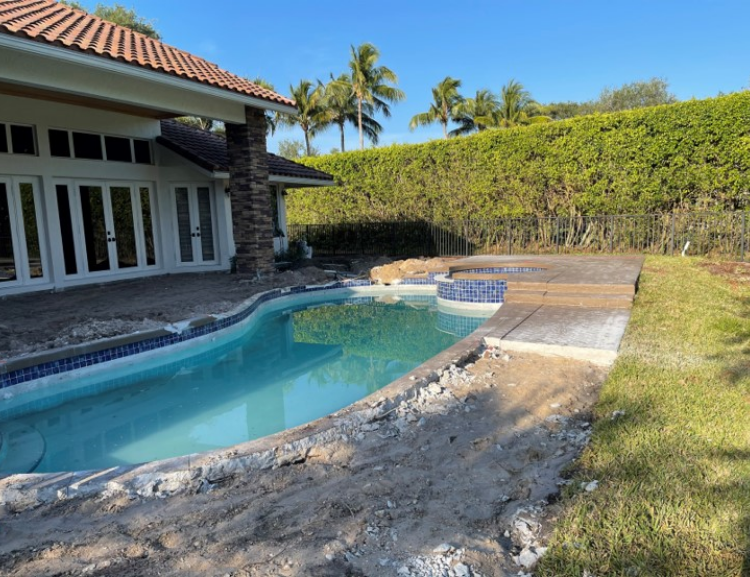 Backyard pool renovation with spa and patio