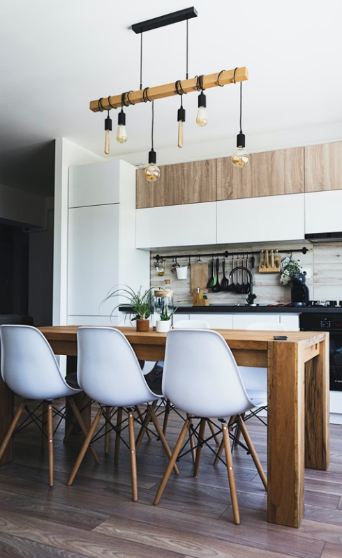 Modern kitchen dining area with wooden table