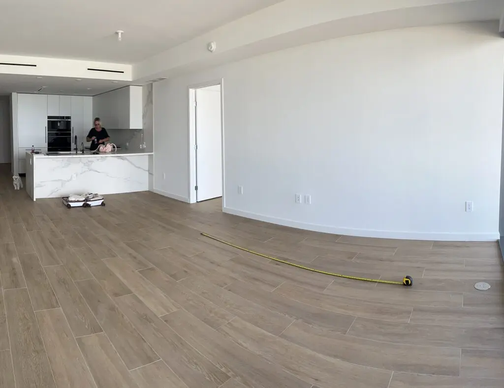 Unfurnished open-plan apartment with kitchen island